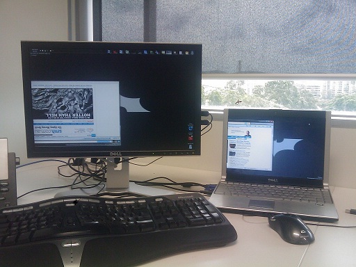 Batman reading the news.